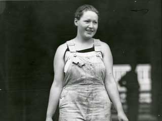 Doris Hansen helps with the milking on the family farm near Worthington, 1935. Loc. no. SA1.31 p30