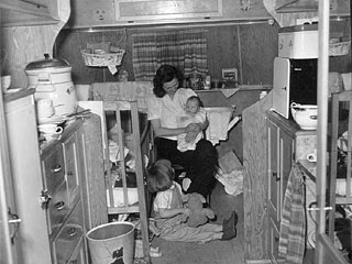 Woman and two children inside a G.I. trailer, 1946. Loc. no. FM6.879 r19