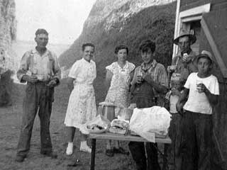 Break from threshing on Evert Mainquist farm, 3 miles east of Buffalo,
Buffalo Township, 1935. Loc. no. SA4.6 r63 