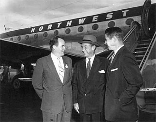 Photo: Hubert H. Humphrey, Adlai Stevenson, and Orville Freeman in front of a Northwest Airlines plane, 1959.