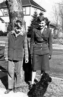 Anne Bosanko Green with her brother, Michael Bosanko, and dog, Midge, 1945. Loc. no. por18139 r4