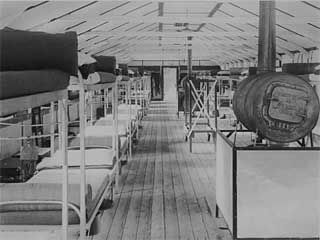 Photo: CCC camp interior, probably Company 707, Deer River, 1936. 