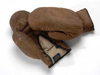 Brown leather boxing gloves, worn by North (Minneapolis) high school student, ca. 1930. 