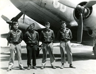 Photo: D-Day Crew – June 6, 1944.  L-R: Robert T. Carr, pilot; Paul Ducharme, co-pilot; Michael Farkas, crew chief; Kriser, radio operator.