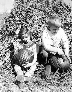 Photo: Children carving pumpkins for Halloween, 1934.