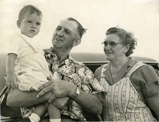 Photo: Danny with his Grandpa and Grandma Cousins at their farm near Griswold, IA, 1954