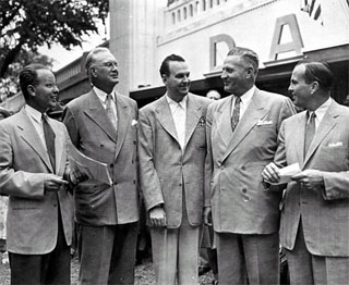 Photo: George Grim (left) with left to right: Harry A. Bullis, Gene Wilkey, Governor Luther Youngdahl and Donald C. Dayton, in front of Dayton's exhibit at the State Fairgrounds, 1950.