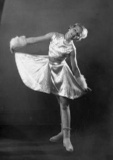 Dorothy Snell, aged 13, posed in figure skating costume, 1934.