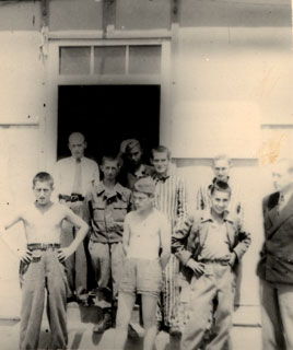 A group of recently released prisoners at Dachau, 1945.