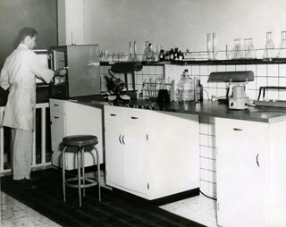 Photo: Dr. Bill Cameron at work in a laboratory, ca. 1950s.