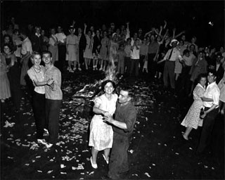 Couples dancing in the street on VJ Day, Minneapolis, August 1945.
