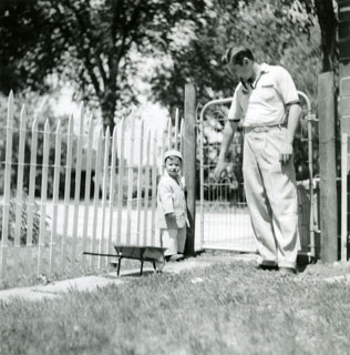 Photo: Bill Cameron with son, David John, in the family's yard in Luverne, June 1956.