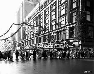 Christmas decorations on Nicollet Avenue in front of Dayton's, Minneapolis, 1954.