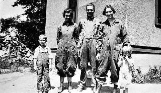 Young women and children dressed for farm work, 1930. 