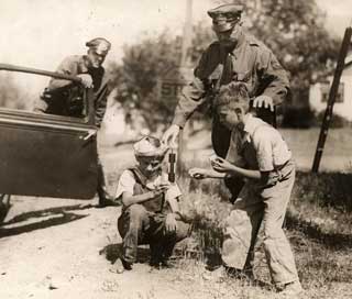 Photo: Boys with fireworks warned by  St. Paul police, 1934.