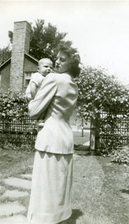 Carolyn Frederick holding baby daughter, Linda, May 1949. 