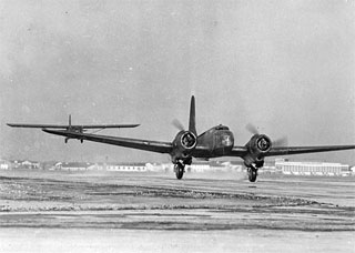 B-23 airplane towing glider, Wold Chamberlain Field, 1943.