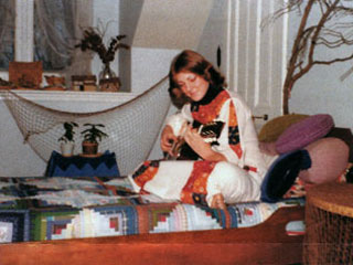 Jeannine Breton Baden with the quilt made by her mother, ca. 1976.