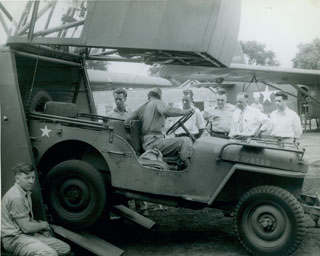 Photo: Unloading a jeep from a CG-4A glider. Image: Bruce Sifford Studio.