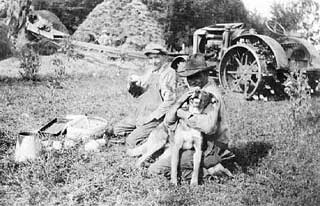 Lunch time during threshing, 1930.