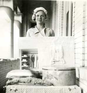 Mary Sjoberg with her exhibit and model of a closet, 1934.