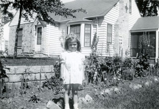 Photo: Mary Maxson, standing in front of her family's home in Richfield, 1944.