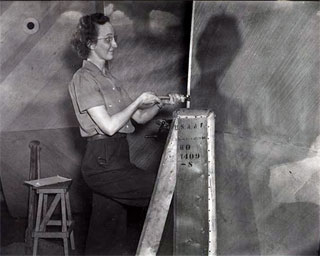 Woman working at Northwest Aeronautical Corporation plant, Holman Field, St. Paul, ca. 1942.