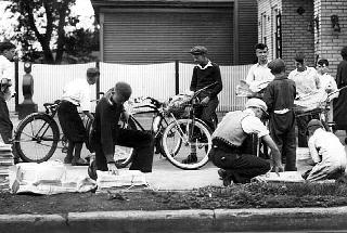 Newsboys picking up newspapers for delivery, 1935.