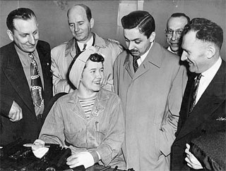 Photo: Legislative members touring St. Paul Modification Center of Northwest Airlines and viewing the work of Patience Peterson, 1945.