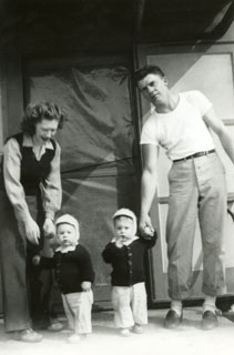 Lee and Ed Sworsky, taking their boys for a walk outside, ca. 1948.