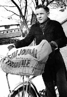 Minneapolis paper carrier with bike, 1938. 