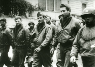 Photo: American POWs being marched through the streets of Rome 
by German captors, [1944?].