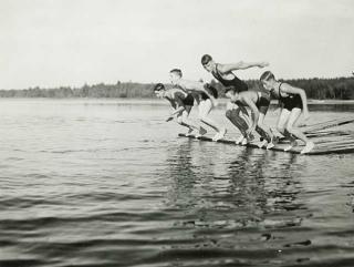 Photo: Boys diving from a raft, Eshquagama Lake, St. Louis County, 1933.