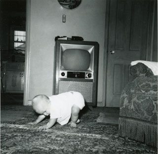 Tim Sworsky, in front of the family's television set, July 1955.