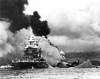 USS Maryland (BB-46) alongside the capsized USS Oklahoma (BB-37), Pearl Harbor, December 7, 1941.