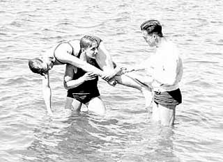 Life-saving methods demonstrated to Civilian Conservation Corps (CCC) boys, 1936. 