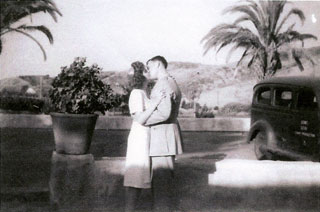 Royal and Doris Solie Bruchman exchange a kiss on their wedding day, July 27, 1945.